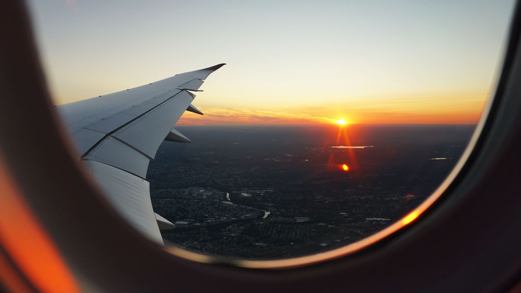 Sunset seen from an airplane. (Eva Darron/Unsplash)
