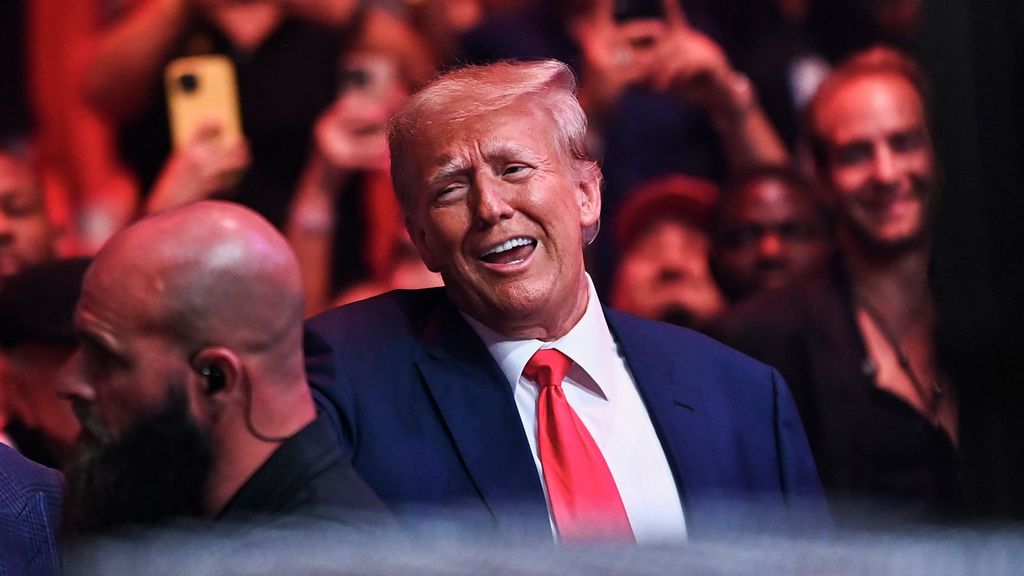 Former President Donald Trump attends the Ultimate Fighting Championship (UFC) 287 mixed martial arts event at the Kaseya Center in Miami, Florida, on April 8, 2023. Trump NFTs spiked in sales after his indictment. CHANDAN KHANNA/BENZINGA