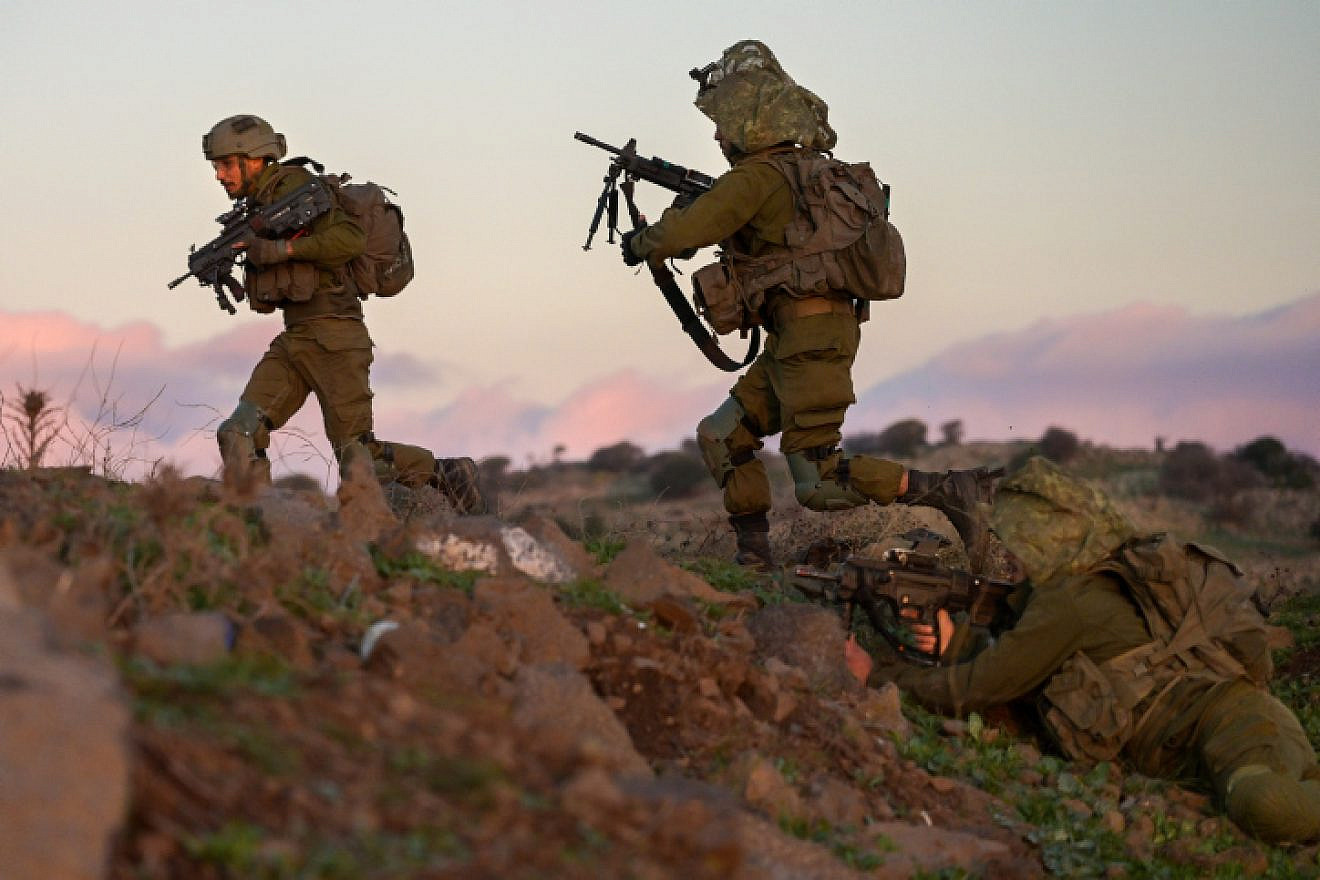 <p>Soldiers from the IDF's Givati Brigade train near Kibbutz Merom Golan on the northern Golan Heights, Dec. 27, 2022. Photo by Michael Giladi/Flash90.</p>