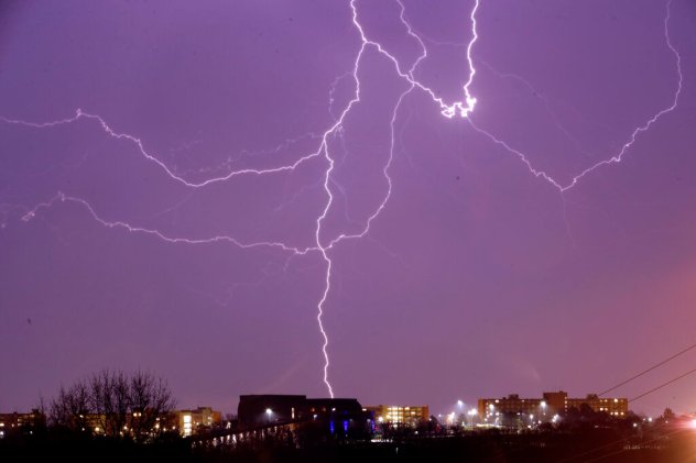 Lightning is seen in the sky over the University of Kansas in Lawrence, Kan., Thursday, March 26, 2020. Strong winds and hail are forecast for the area. Texas topped the list of the states where the highest number of lightning events occurred, followed by Florida, Louisiana, Oklahoma and Mississippi. ORLIN WAGNER/ACCUWEATHER