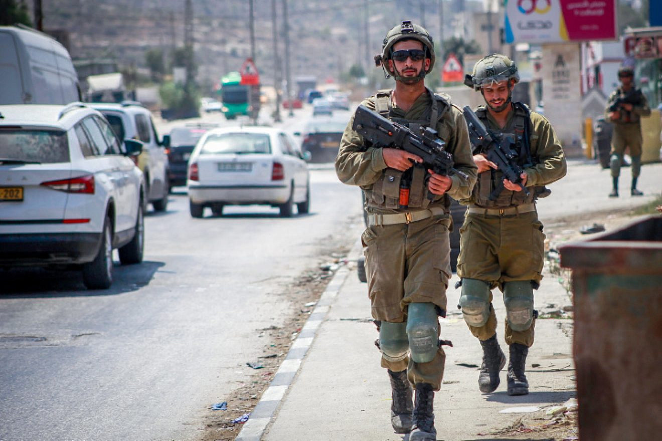 <p>Israeli soldiers patrol at the scene of a deadly shooting in Huwara, near Nablus, Aug. 20, 2023. NASSER ISHTAYEH/FLASH90.</p>