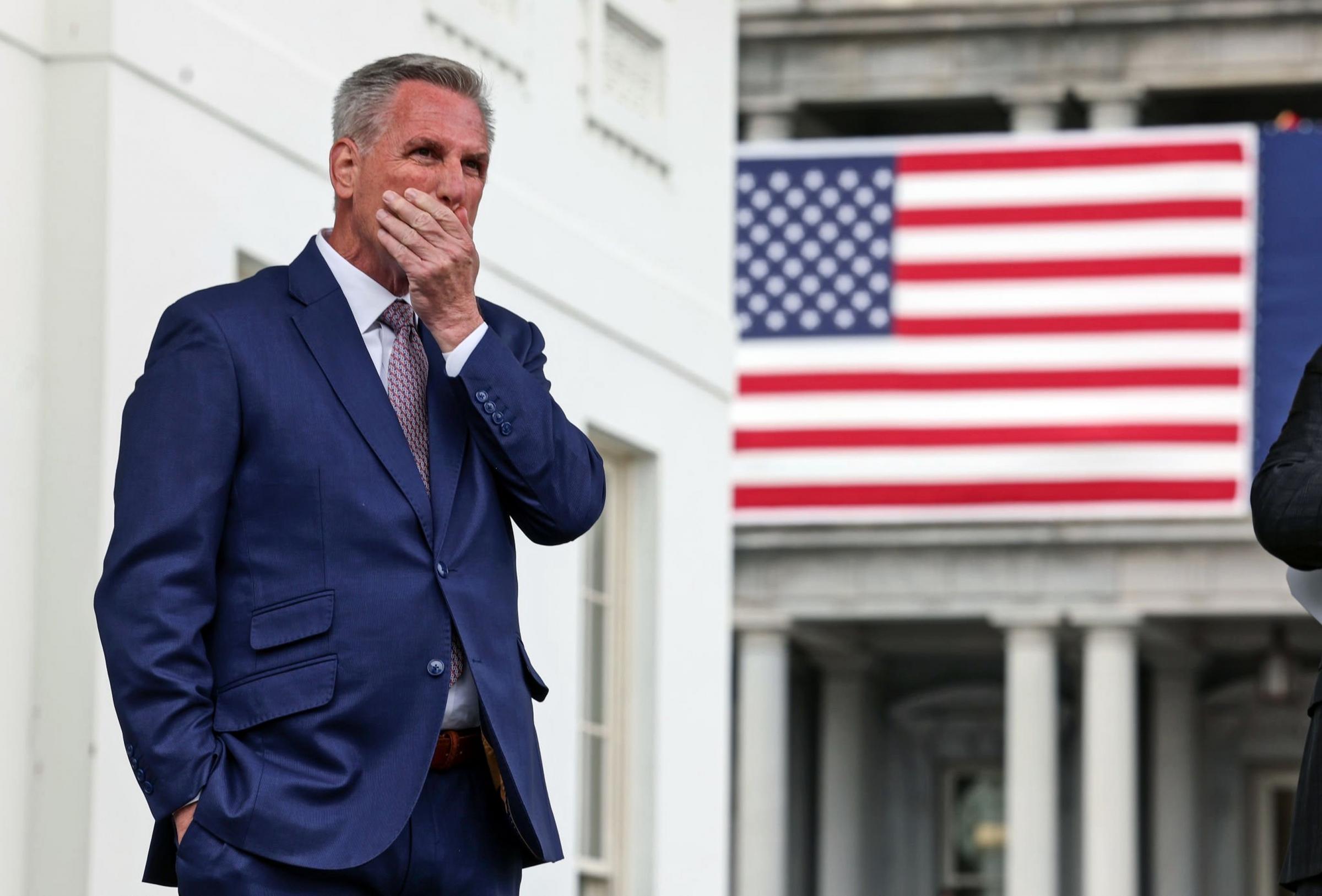 House Leader Kevin McCarthy (R-Calif) standing outside the Capitol pondering votes. The California Republican Congressman has failed to convince 20 Republicans who oppose his speakership. TOM WILLIAMS/BENZINGA