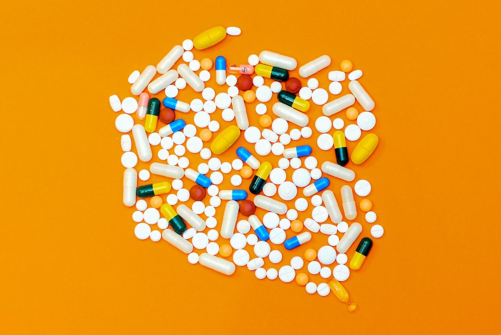 A pile of medication on the table. A new study found that Americans who take daily multivitamin supplements may slow down memory loss. MICHAL PARZUCHOWSKI/SWNS TALKER