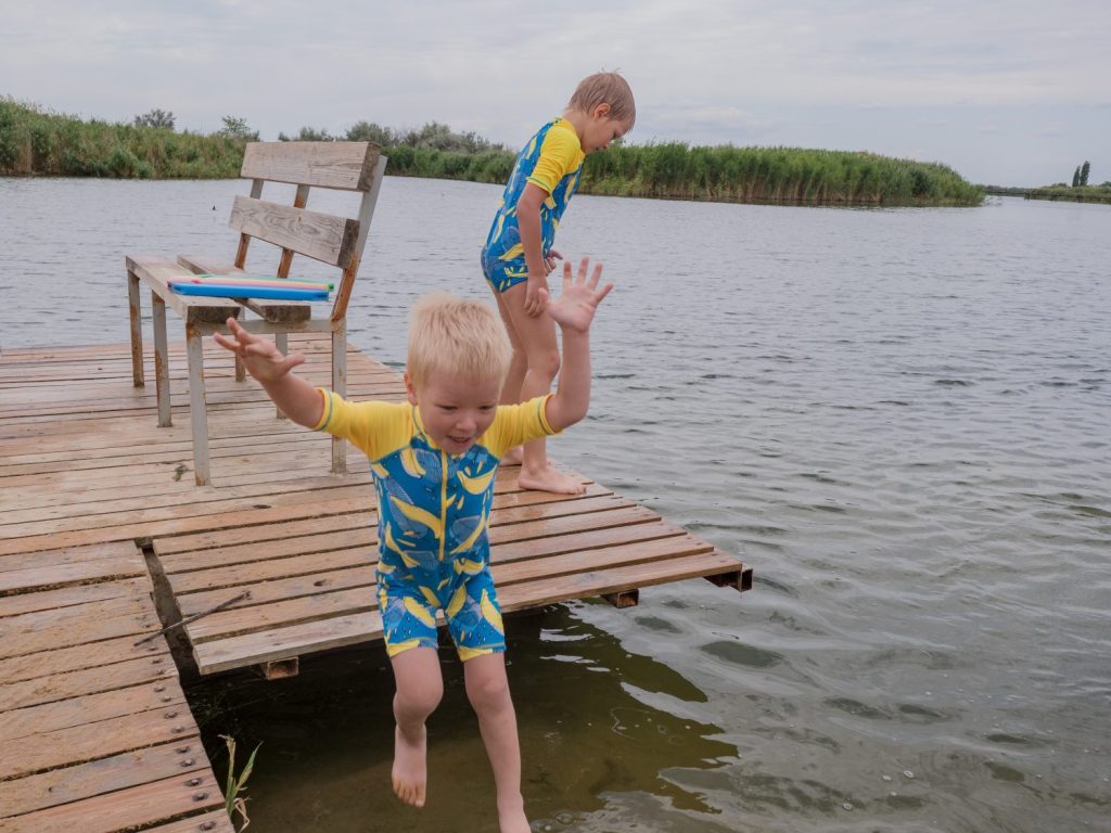 Two kids are going for a swim. People with no access to water bodies are more vulnerable to mental health issues in contrast to those with frequent access. PHOTO BY MAPLES IMAGES VIA SHUTTERSTOCK