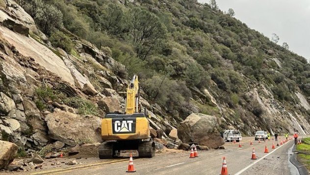 An image of an excavator near the boulders that crashed down the side of the mountain on Monday along State Route 168 in Fresno County, California. Since New Year's Eve, a parade of storms has slammed the Pacific Coast, the damaging rainfall and intense winds focused primarily on Northern and Central California. TWITTER/ACCUWEATHER