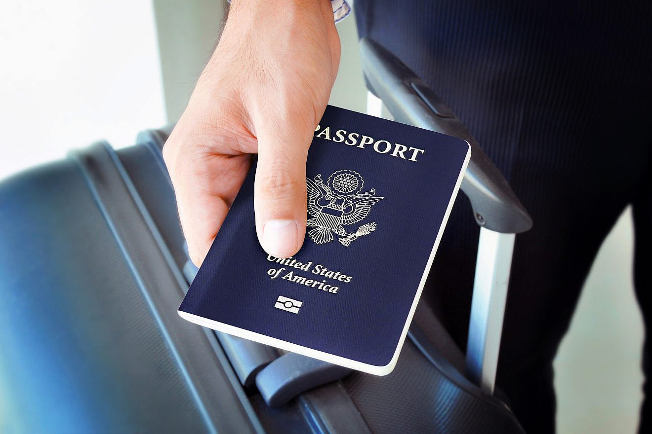 <p>A traveler holds a U.S. passport. The U.S. State Department released a fact sheet about the memorandum of understanding that Washington and Jerusalem signed on July 19 on the Visa Waiver Program. ATSTOCK PRODUCTIONS/SHUTTERSTOCK.</p>