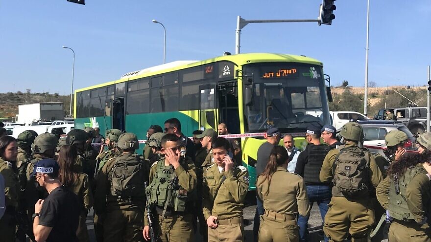 <p>Israeli security personnel at the scene of a terrorist attack on a bus near Neve Daniel in Gush Etzion, south of Jerusalem, March 31, 2022. Wednesday’s double terror bombing in Jerusalem sent shock waves throughout the State of Israel because it was a different style of attack than the one Israelis have, sadly, grown accustomed to seeing since March this year, when the latest escalation began. ISRAEL KASNETT/JNS</p>