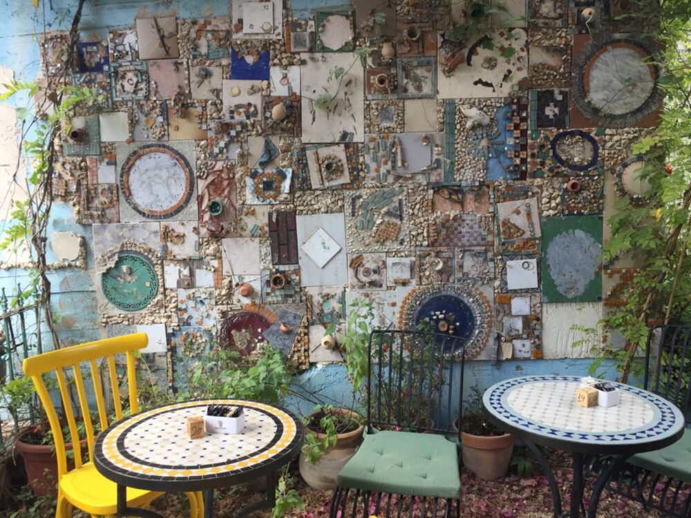 The mosaic wall of the outdoor dining area at Tupelo Bakery. Photo by Diana Bletter