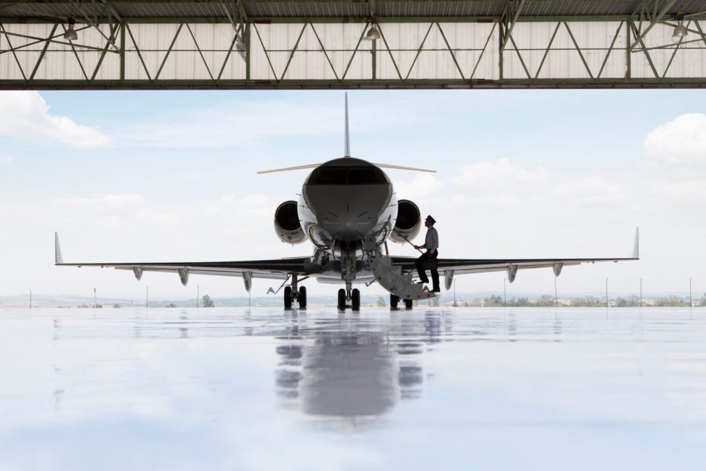 Private jet parked in the hanger while the chief pilot walks inside. Children who live near airports are still being exposed to dangerous levels of lead, warns a new study. JUICE FLAIR/SWNS TALKER