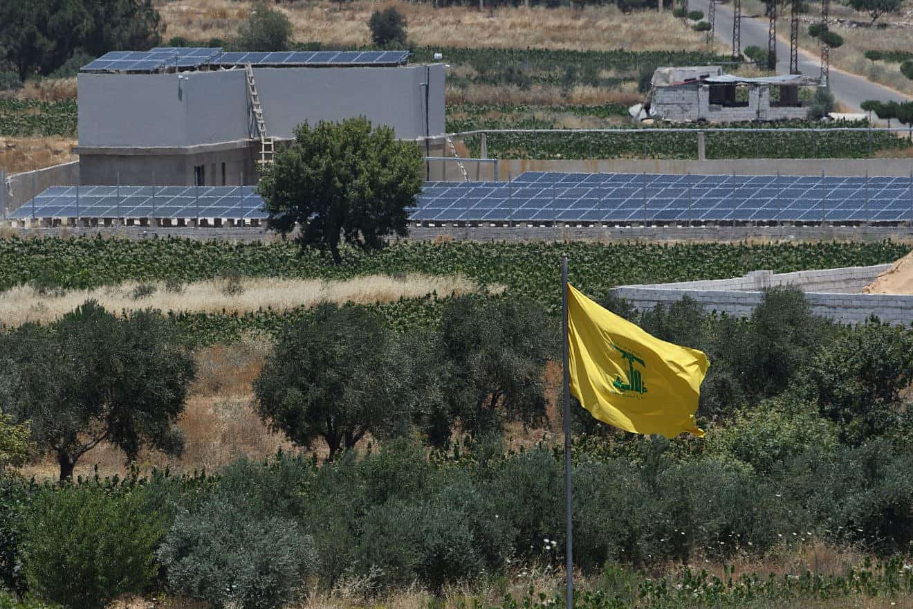 <p>A Hezbollah flag in Lebanon, as seen from the Israeli side of the border in June 2023. Israeli PM Benjamin Netanyahu has vowed to eliminate crime in the Arab sector amid ongoing violence in the minority population. AYAL MARGOLIN/FLASH90.</p>