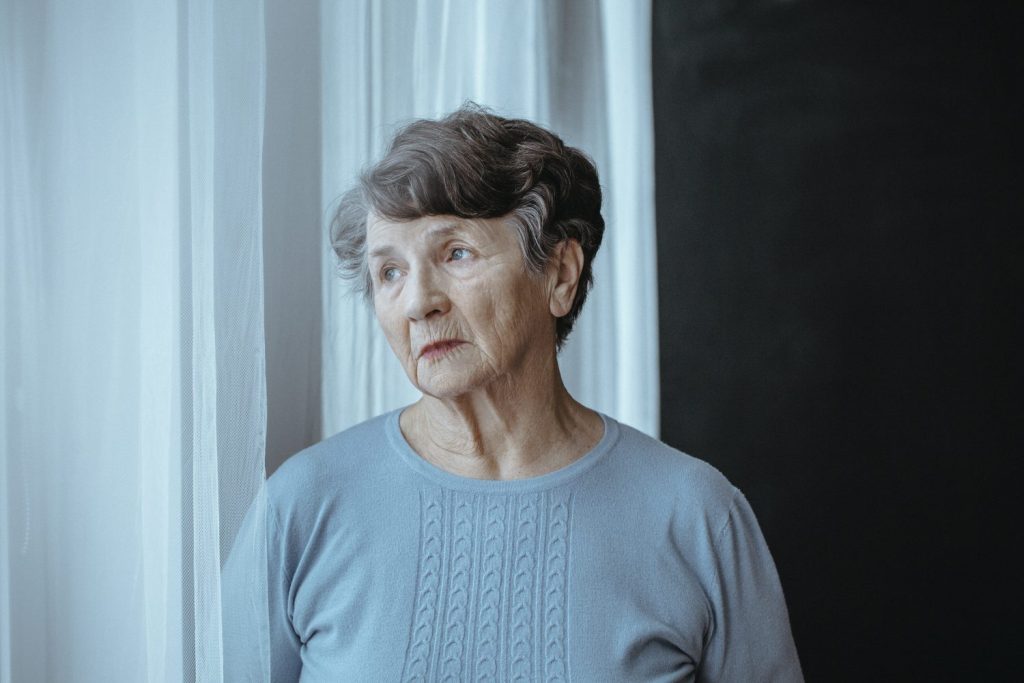 An elderly woman looking outside of her home.A smart patch that can detect Alzheimer's within six minutes has been developed by British scientists. GROUND PICTURE/SWNS TALKER