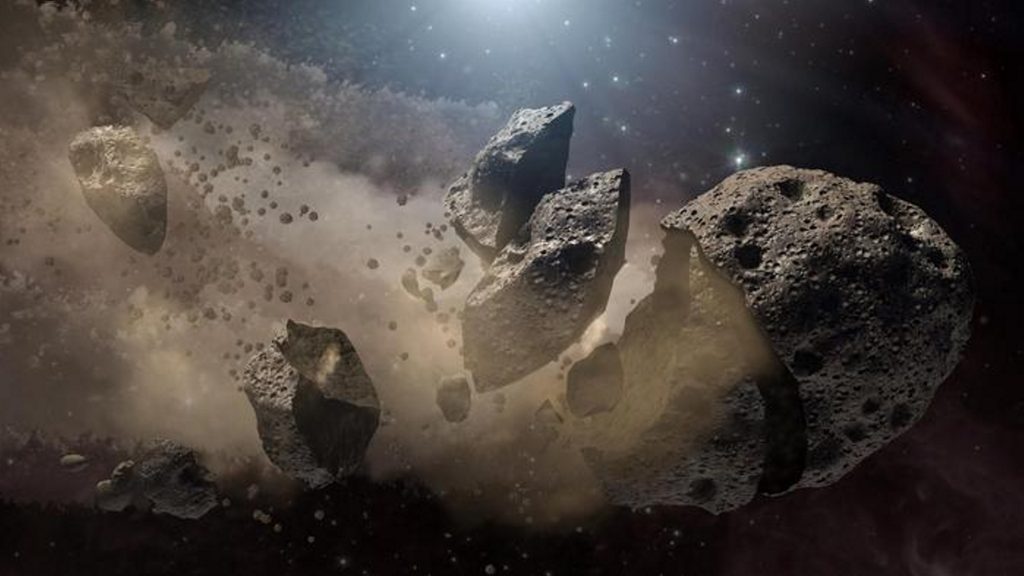 An asteroid is breaking up, producing a lot of dust, which reaches the Earth eventually. PHOTO BY NASA/SWNS 