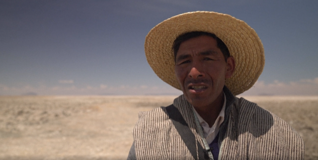 Luis Valero, the spiritual leader of Lake Poopo's Uru Indigenous community, talks to AFP with the dried up Lake Poopo in the background. 