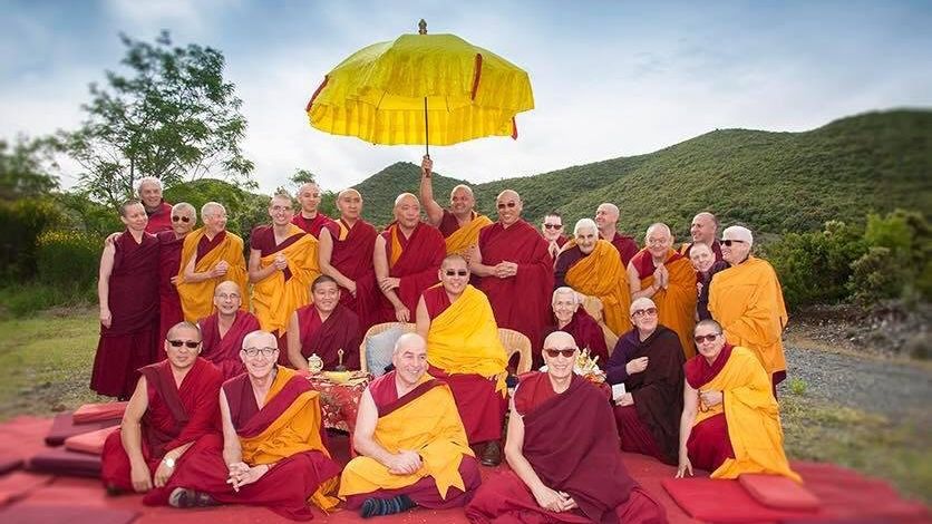 
            A group photo of monks at FPMT, with Rinpoche sitting in the center. Photo by Pierro Sirianni, courtesy of Peljor. 
          