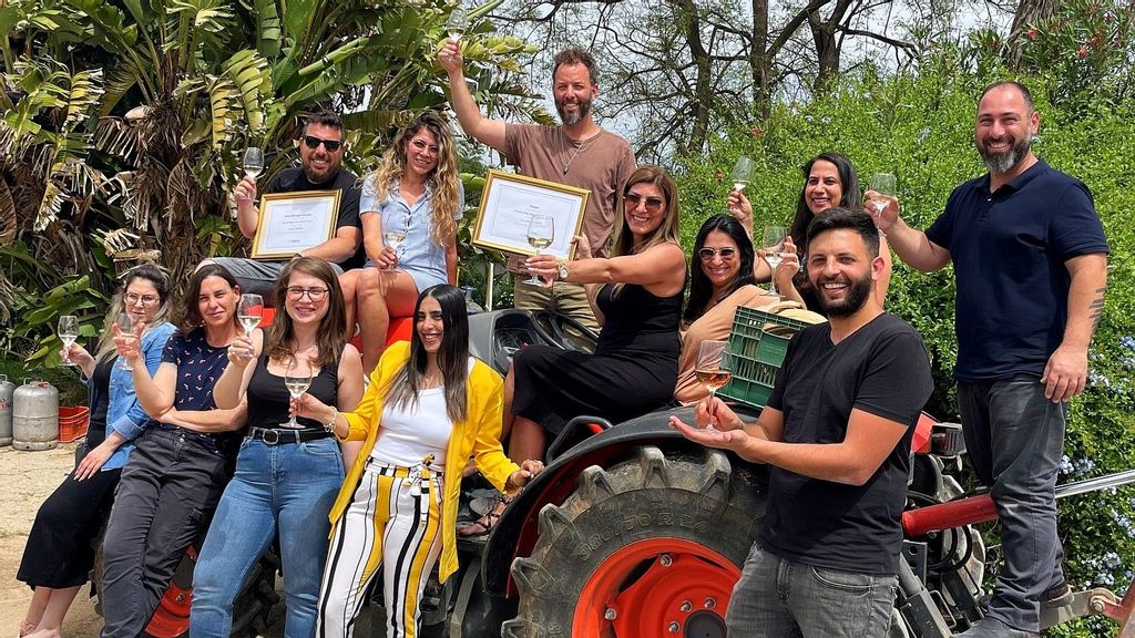 The image shows Ptora's employees celebrating award win. Ido Tamir is the current owner of this family business. He took it over from his father, who took over from his own dad, an immigrant to pre-state Israel from Germany right before World War II. PHOTO BY PTORA