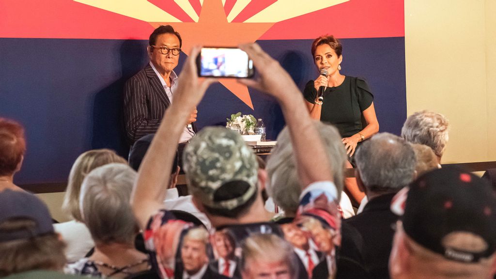 Republican candidate for Governor of Arizona Kari Lake (R), flanked by US businessman Robert Kiyosaki, answers questions written in advance during her Ask Me Anything Tour in Sun City, Arizona, on October 21, 2022. OLIVIER TOURON/BENZINGA