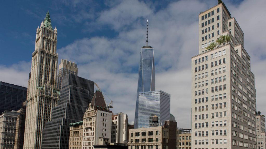 Modern and 19th century architecture (Woolworth buiulding far left) in Manhattan, New York City including the new version of the World Trade Center in the middle. High-rise buildings are mostly corporate offices though some apartments in this, one of the world's great megacities. IN PICTURES LTD/BENZINGA