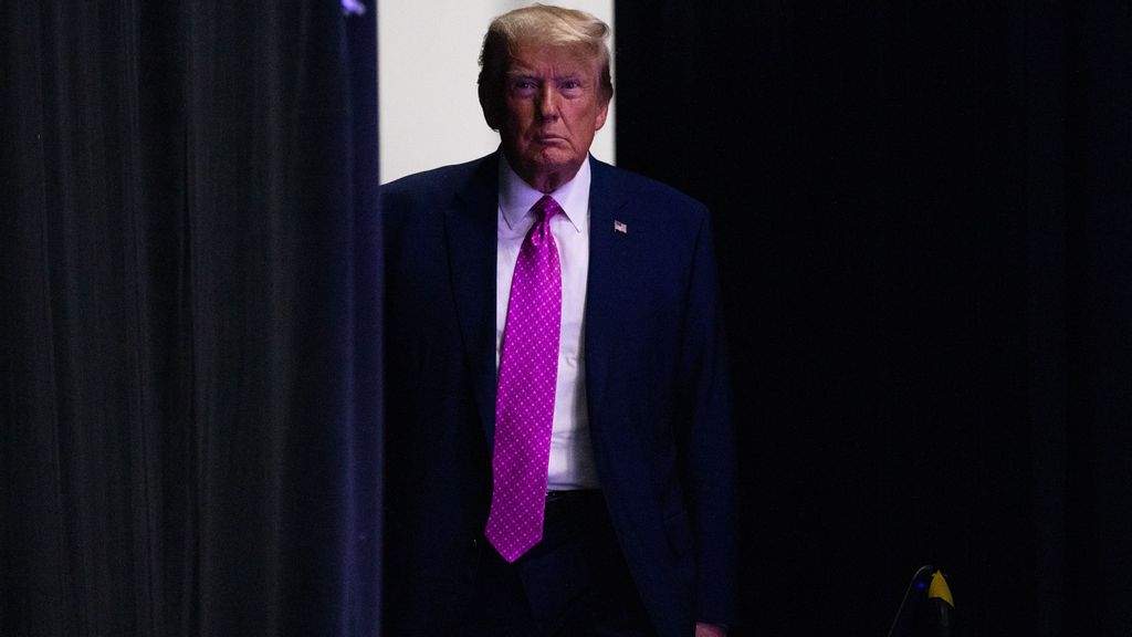       Former President Donald Trump makes his way onto the stage during the Oakland County GOP Lincoln Day Dinner at the Suburban Collection Showplace in Novi, Michigan on June 25, 2023. (EMILY ELCONIN/GETTY IMAGES) 