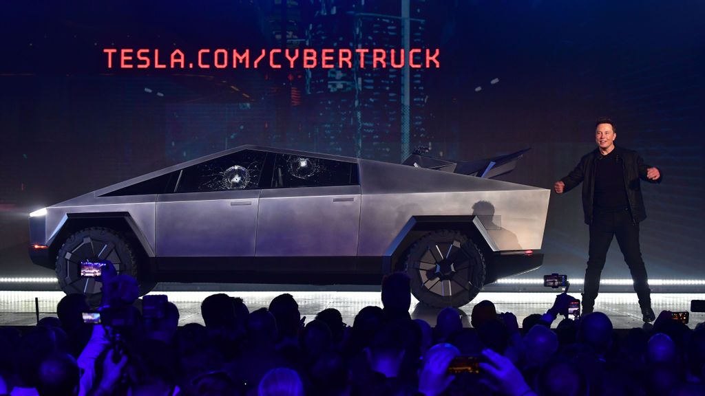       Tesla co-founder and CEO Elon Musk on stage with the newly unveiled all-electric battery-powered Tesla Cybertruck with broken glass on windows following a demonstation that did not quite go as planned on November 21, 2019 at Tesla Design Center in Hawthorne, California. (FREDERIC J. BROWN/GETTY IMAGES) 