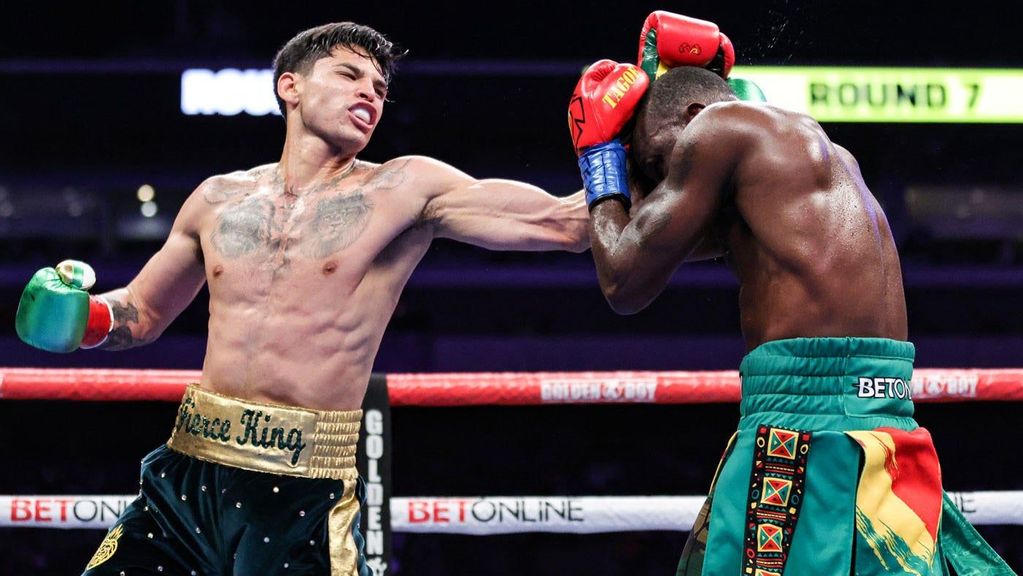 Ryan Garcia (L) throws punches at his opponent Emmanuel Tagoe (R) at their light weight fight. Ryan Garcia will square off against Oscar Duarte at the Toyota Center in Houston, Texas on December, 2. TOM HOGAN/GOLDEN BOY PROMOTIONS  VIA GETTY IMAGES.