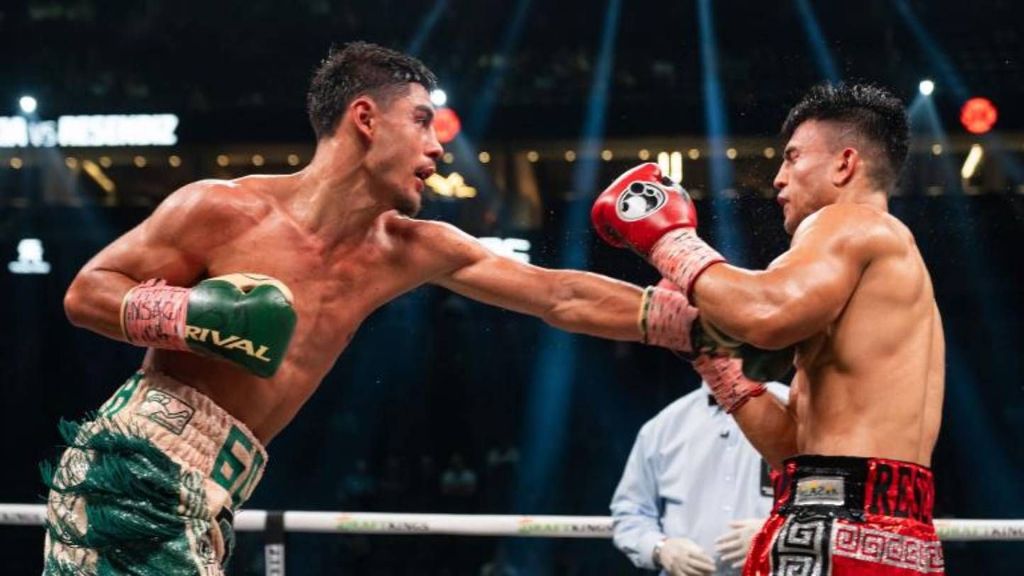 <p>Elijah Garcia (green/tan trunks) trades punches with Armando Resendiz of Mexico (red trunks) during their middleweight fight. The main event on the live streaming platform of PBC on Prime Video will feature a 10-round bout between  Elijah García and contender Kyrone Davis on Saturday, March 30 at T-Mobile Arena in Las Vegas,. SARAH STIER/GETTY IMAGES.</p>