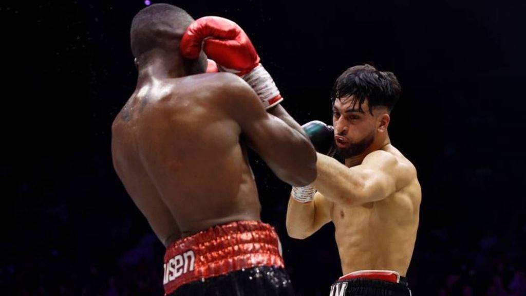  Adam Azim punches Enock Poulsen during the EBU European Super Lightweight Title fight in London, England. Super-lightweight competitors are already vying for Azim's attention after he became the European champion. JAMES CHANCE/GETTY IMAGES.