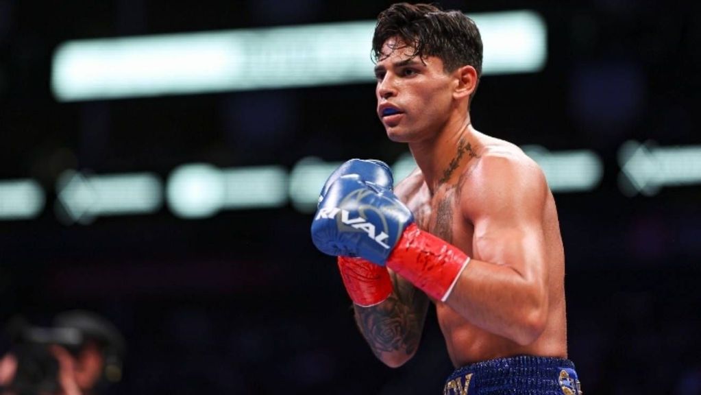 Ryan Garcia looks on while facing Oscar Duarte during their welterweight fight at Toyota Center in Houston, Texas. Ryan Garcia responds to a harsh hollywood actor's criticism of boxing star. CARMEN MANDATO/GETTY IMAGES.