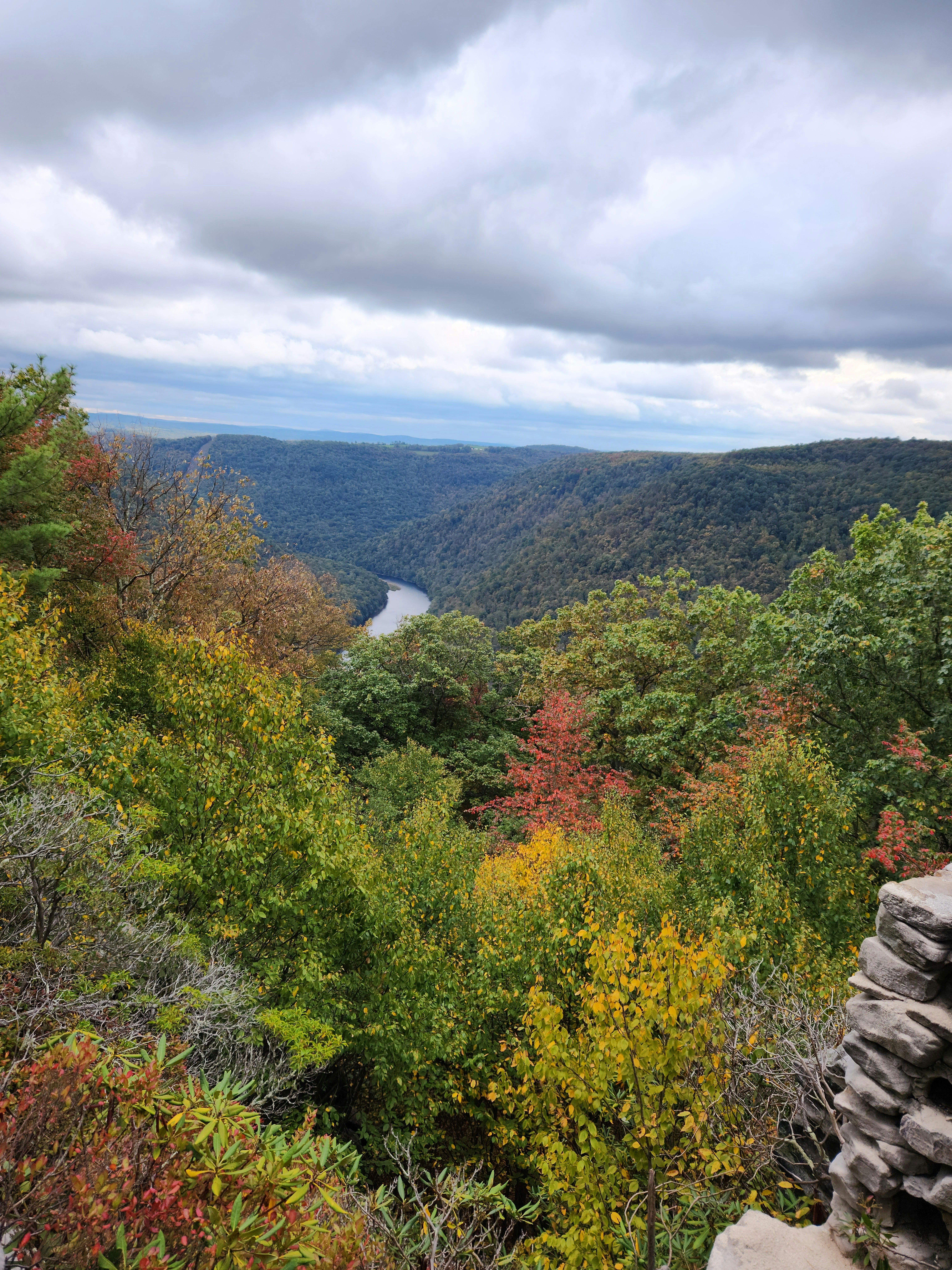 A mountain view of the river with a sky. It is predicted that the weather in the mid-Atlantic and the Midwest will reach highs in Septmeber and October. 