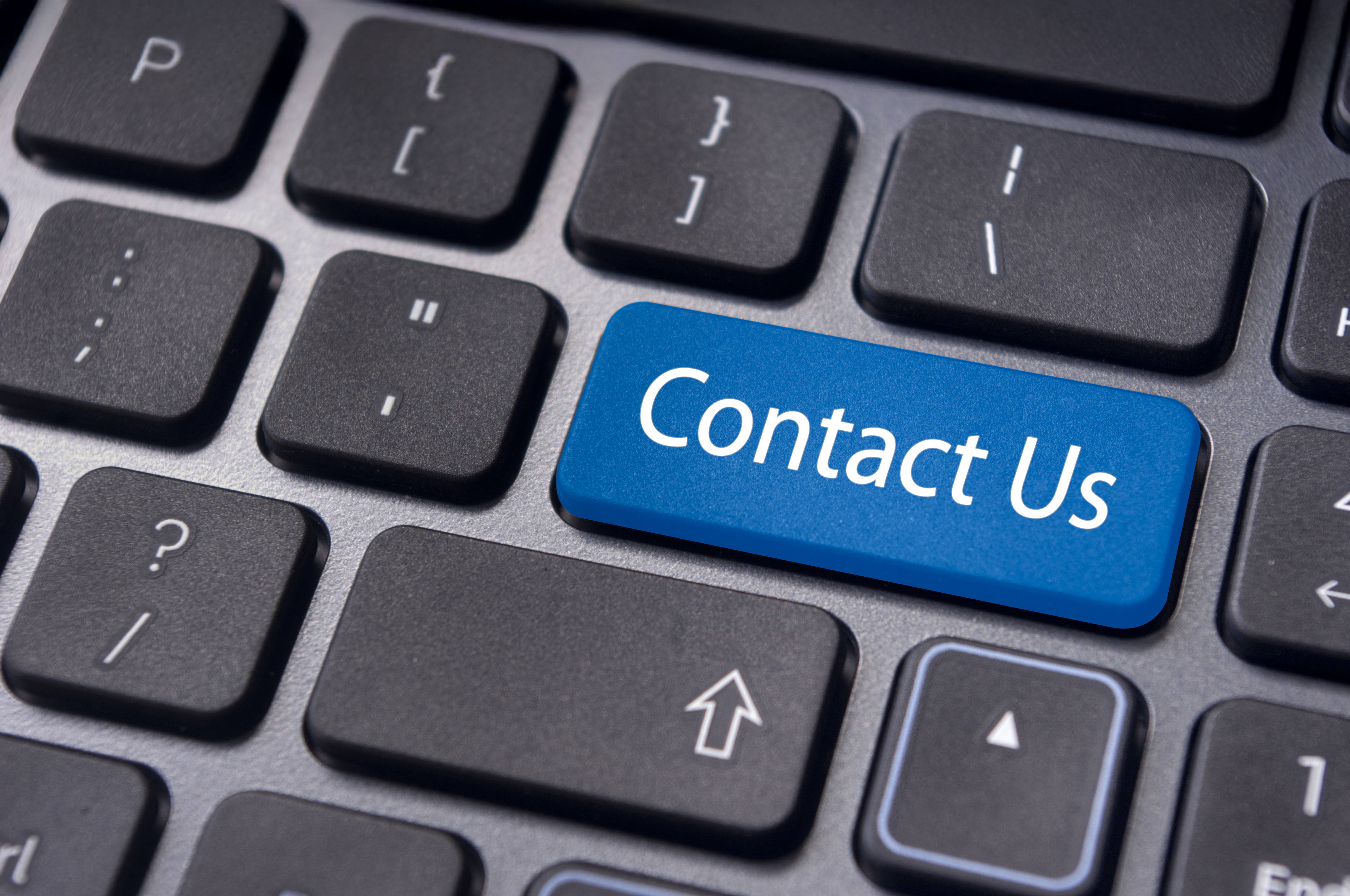 Keyboard with blue “Contact Us” button key