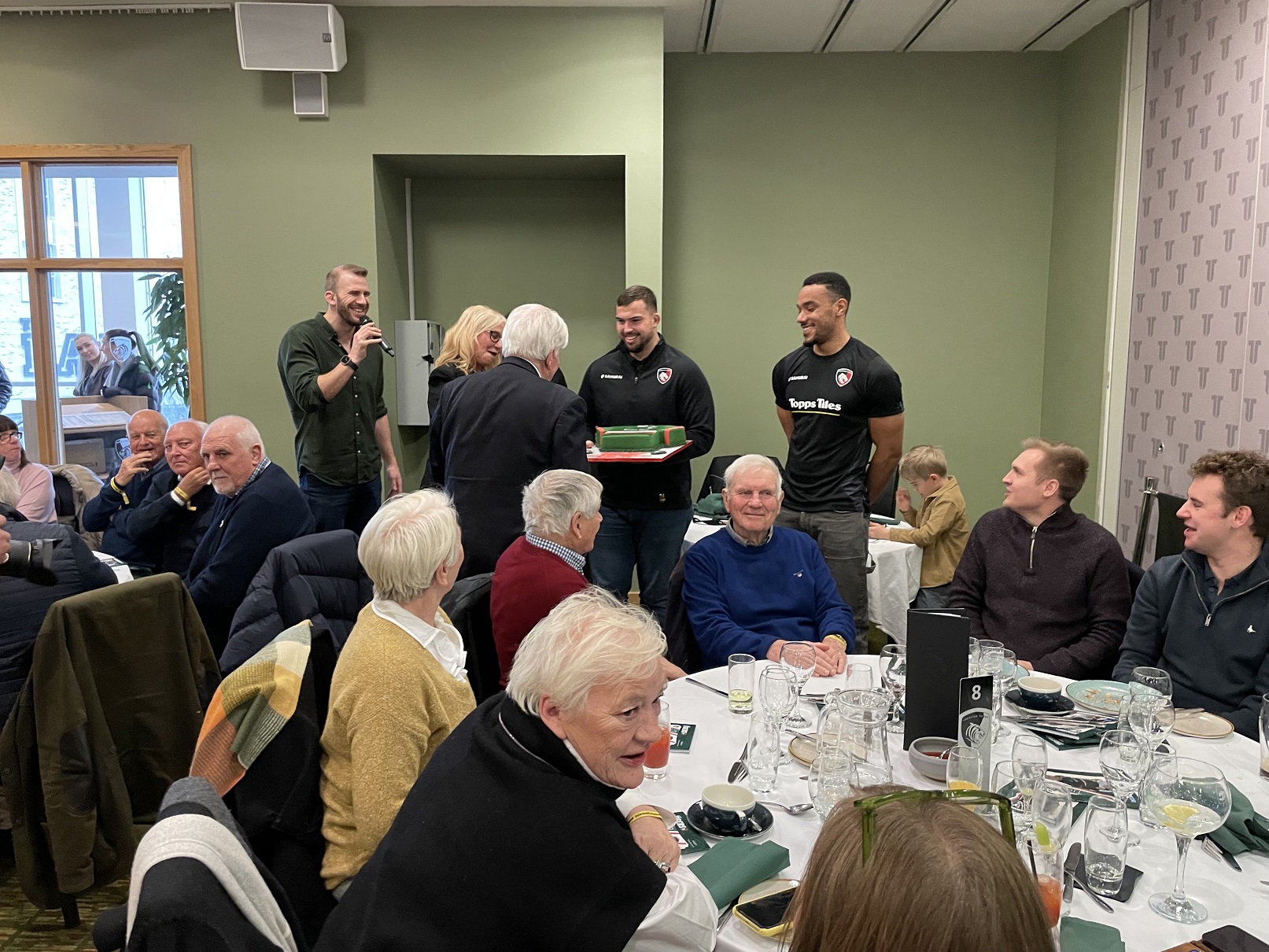 Martin Romilly being presented with his special birthday cake.