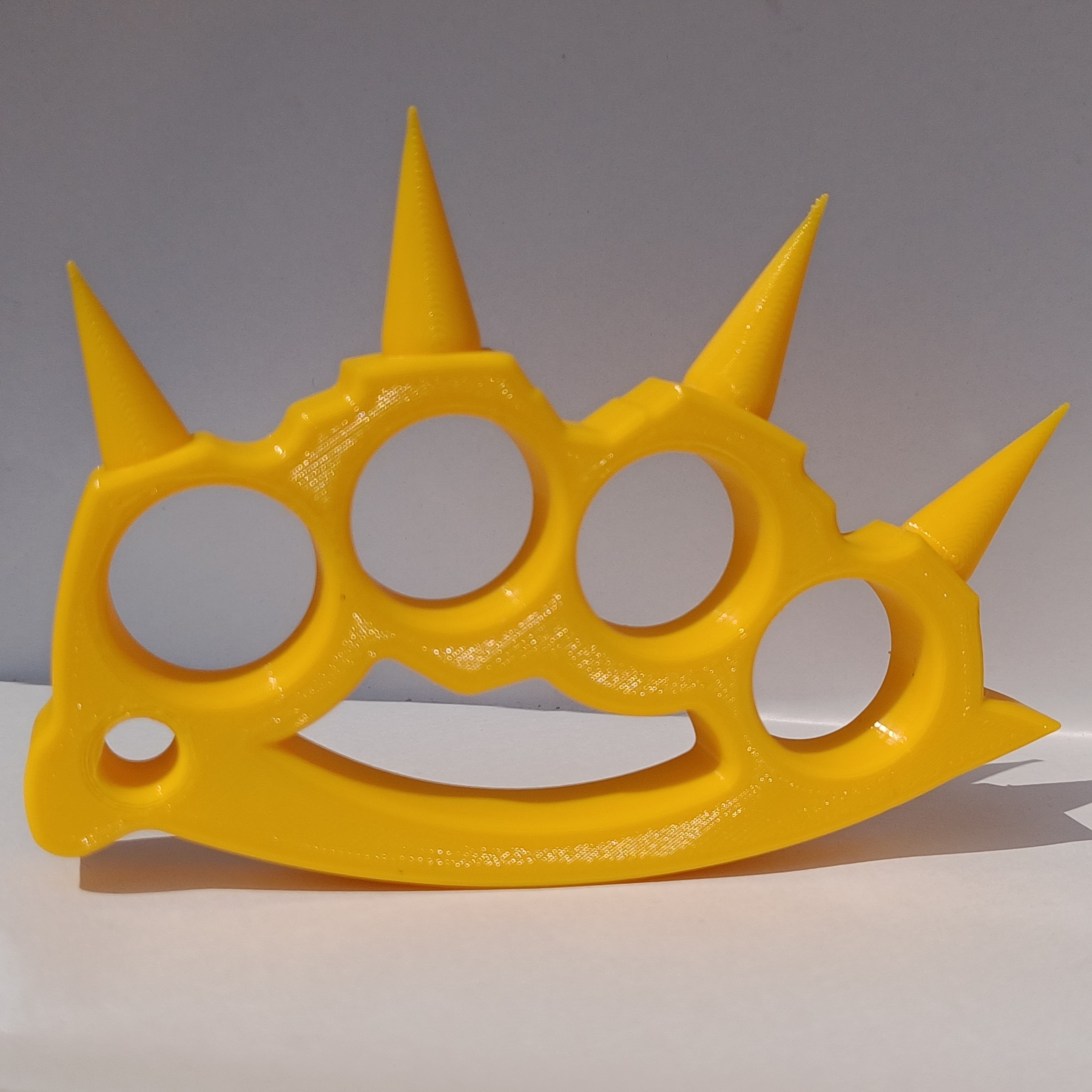 3D Printed ”Brass” Knuckles! My own design so I'm pretty proud. On  Thingiverse if you want it:) thing:4939644 : r/3Dprinting