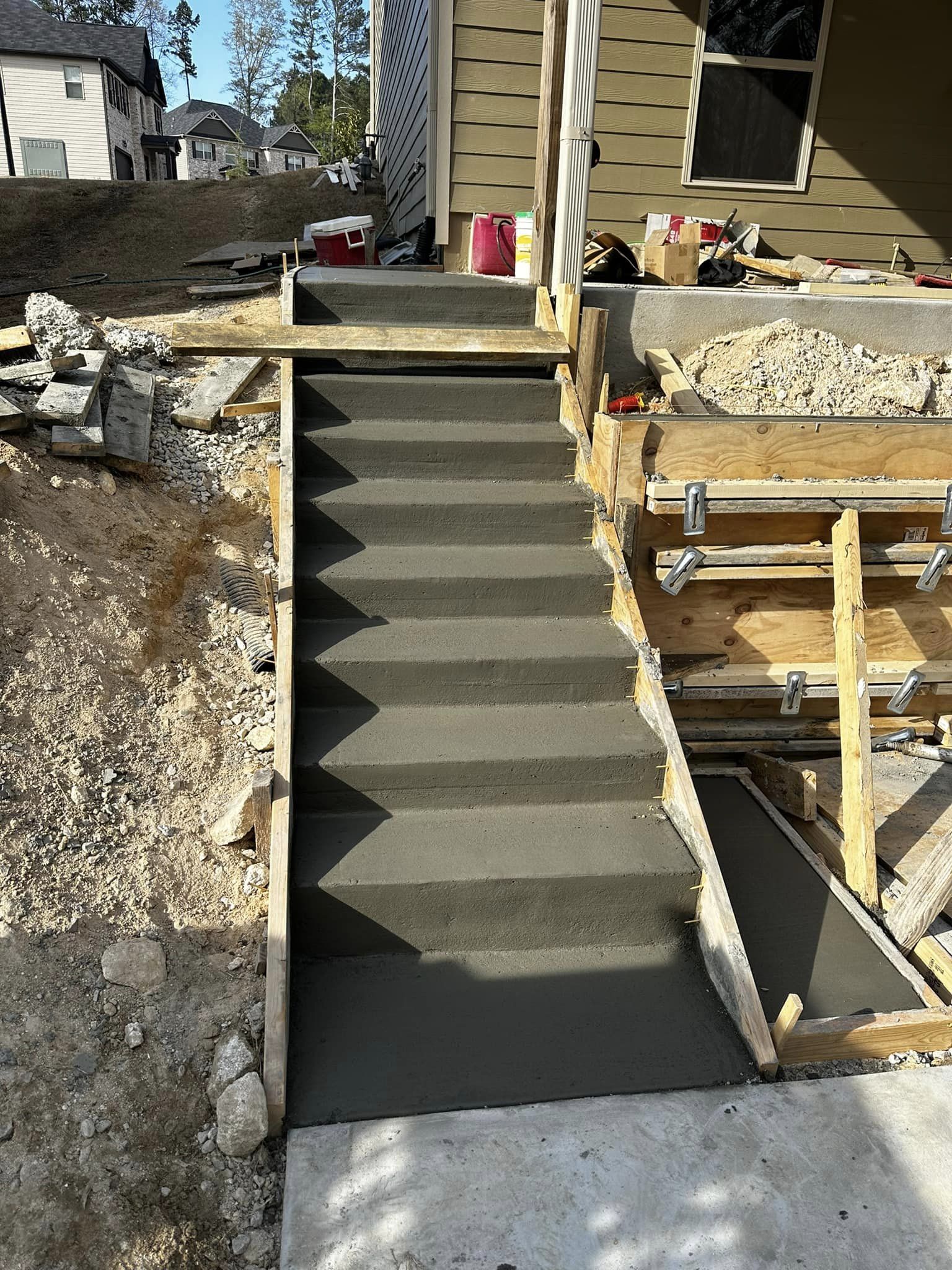 Concrete steps installed by GA Peach Concrete, providing safe and sturdy access for homes and businesses. Expert craftsmanship ensures great results.