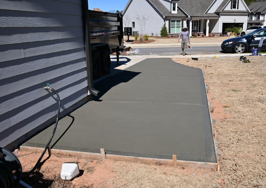 Driveway extension service by GA Peach Concrete, expanding the parking area for additional convenience and functionality.