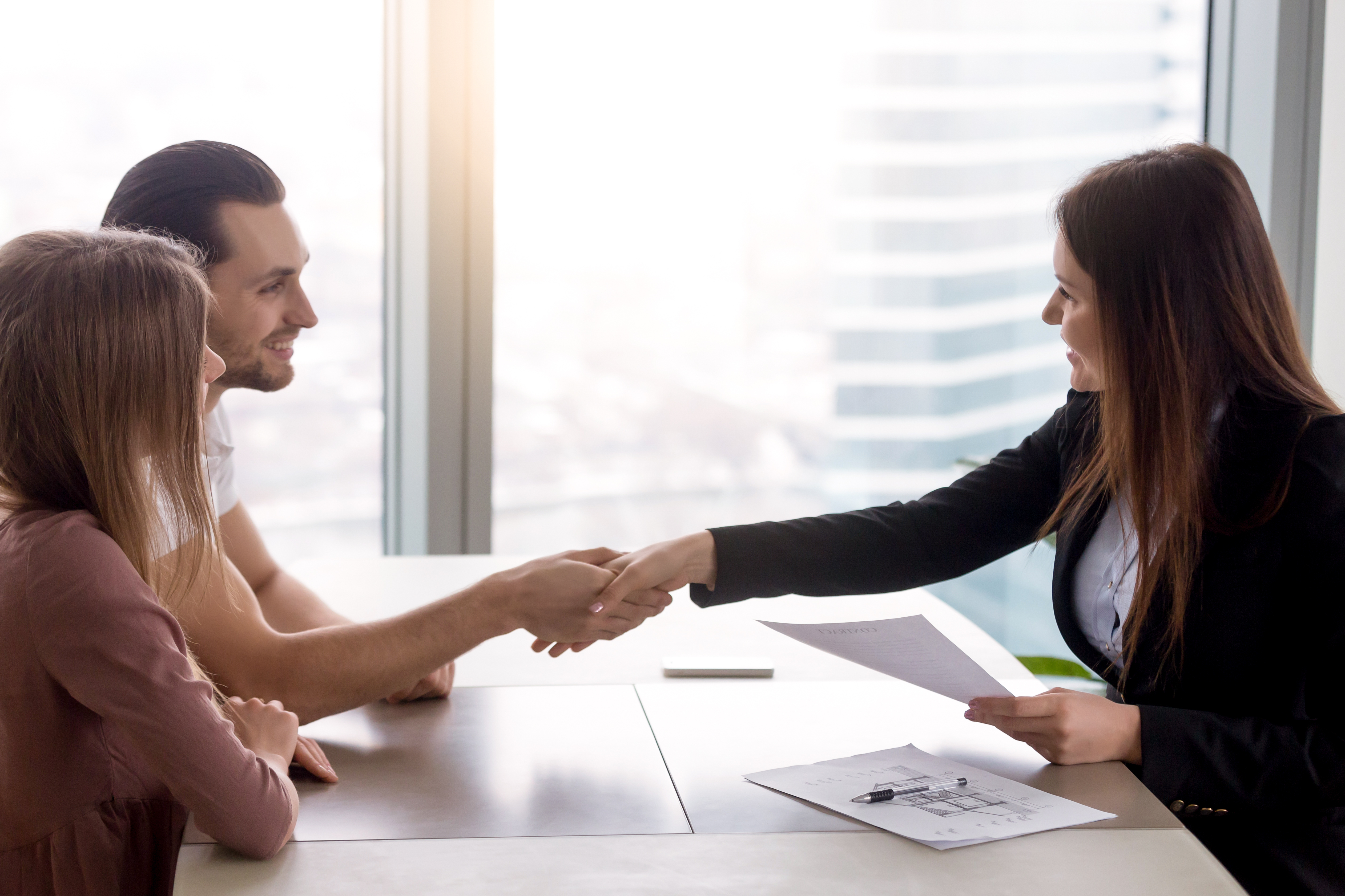 Couple Client Shaking Hands To Insurance Agent