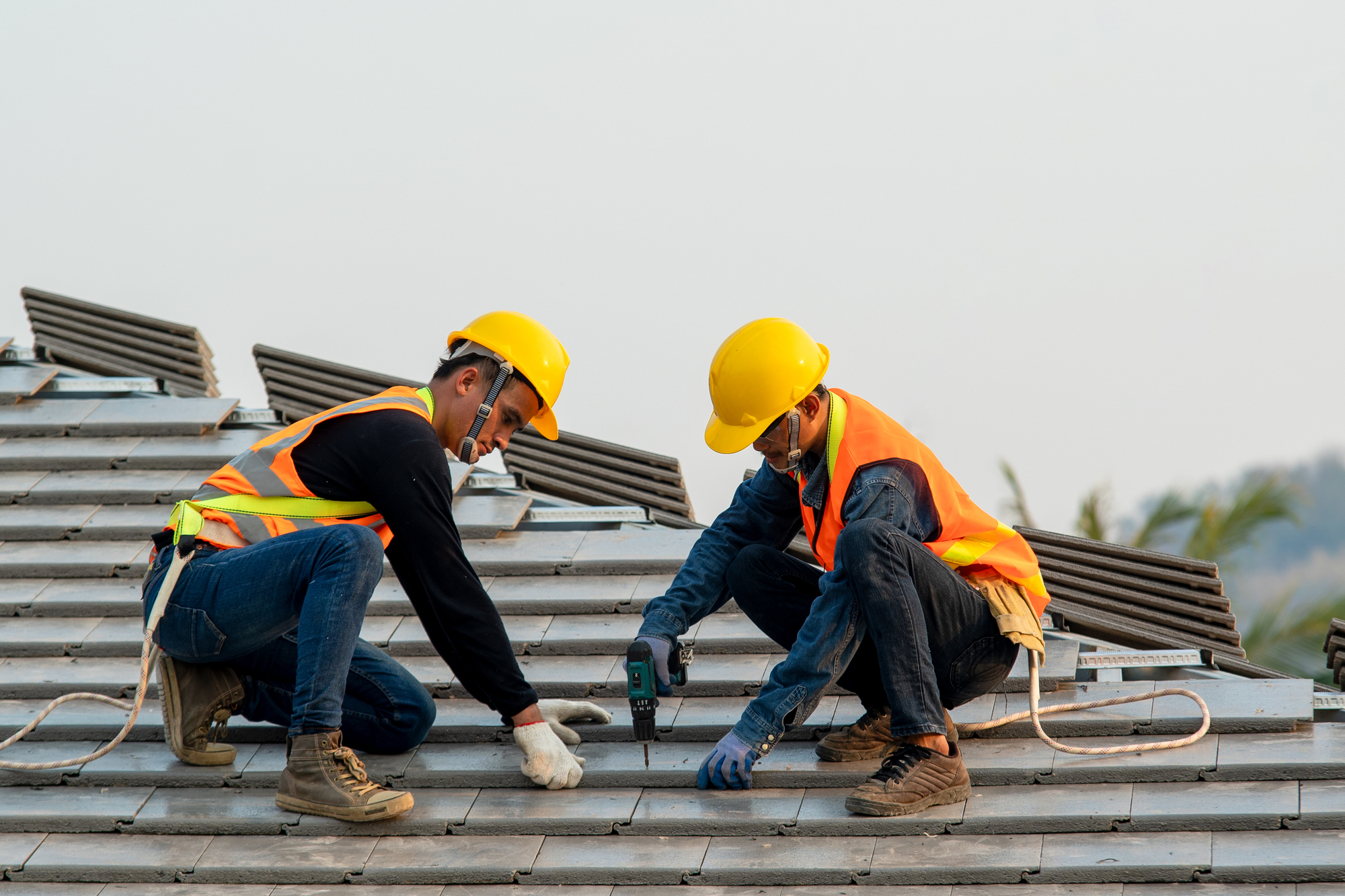 Workers Installing Roof On A Residential Property