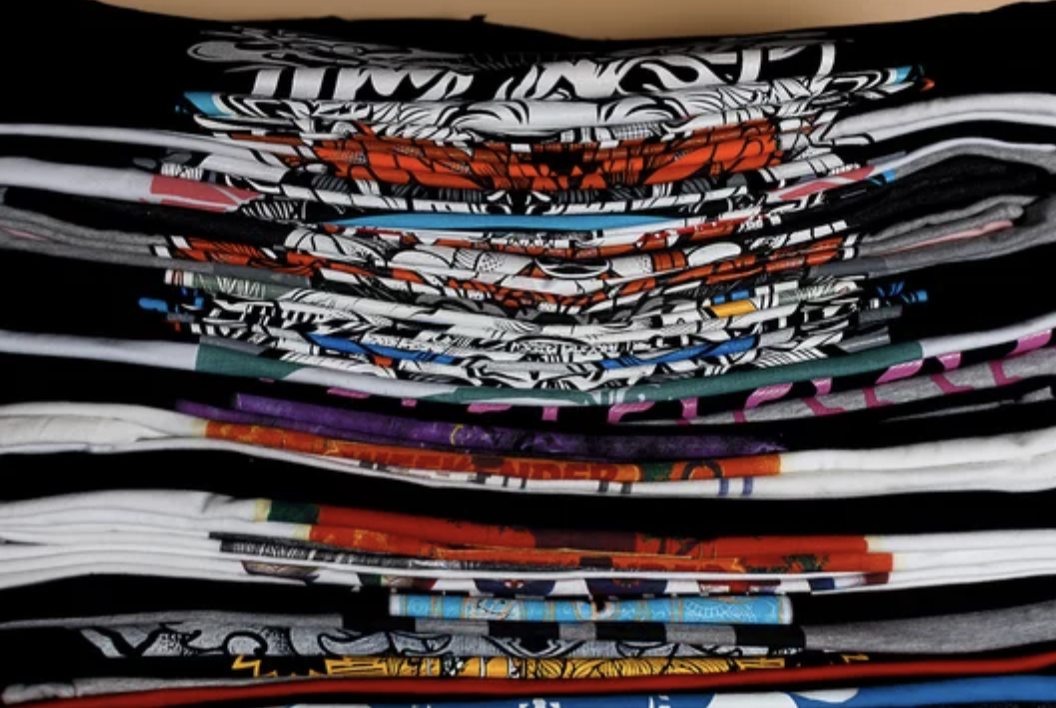 A stack of colorful t-shirts