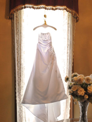 Bride's gown hanging on the window