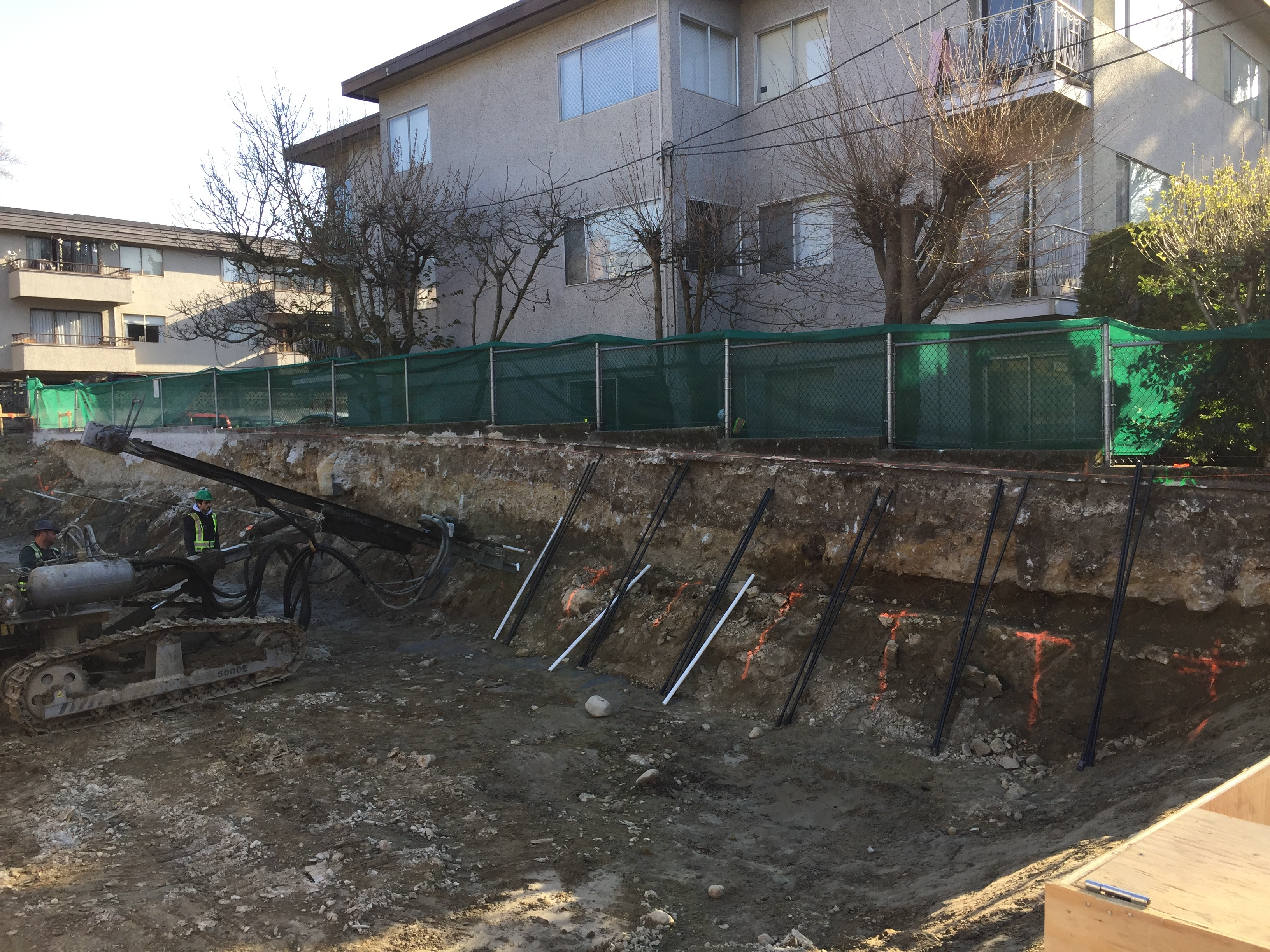 Workers digging on the ground to make a foundation