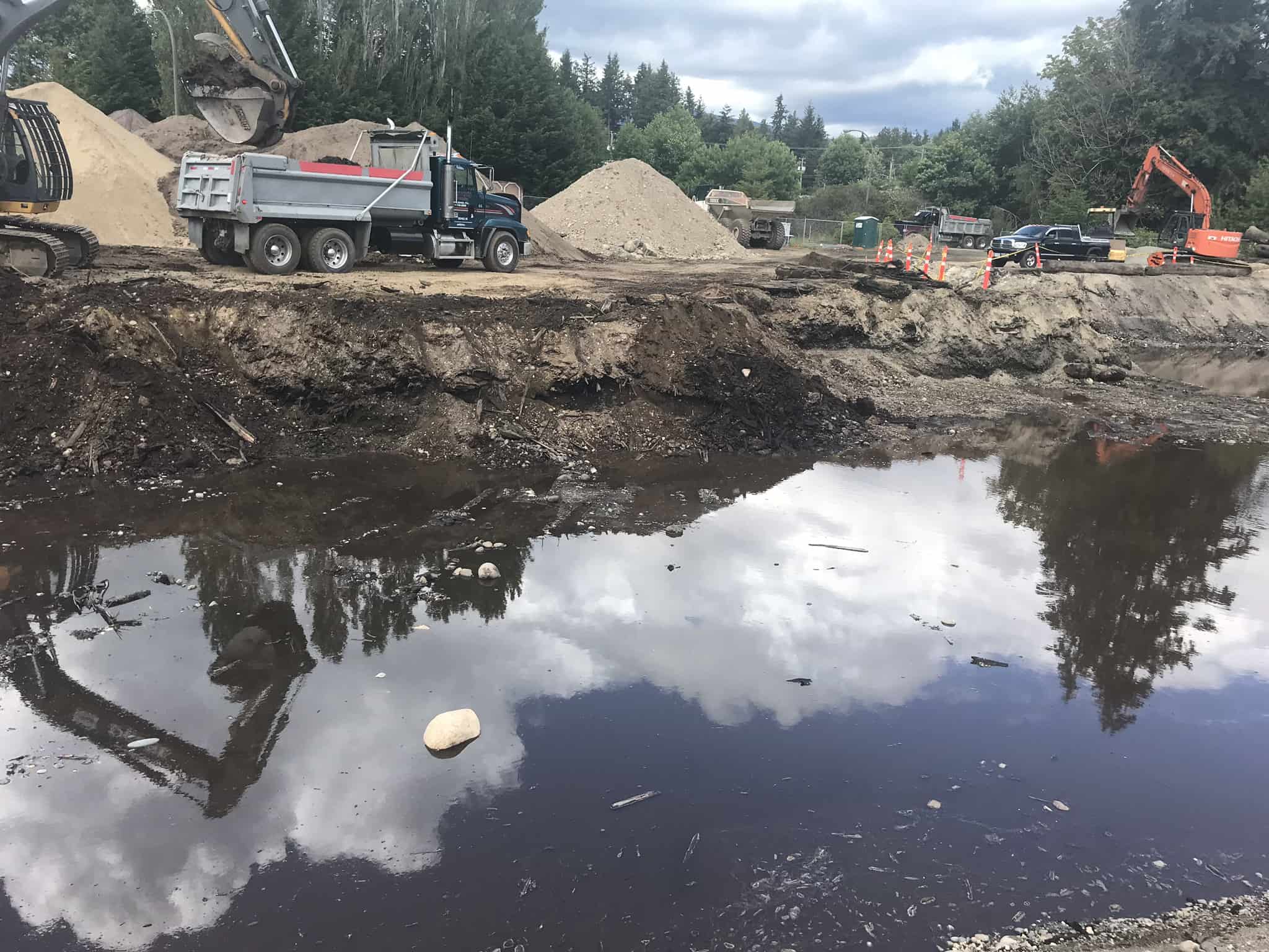 Pouring soil into the water