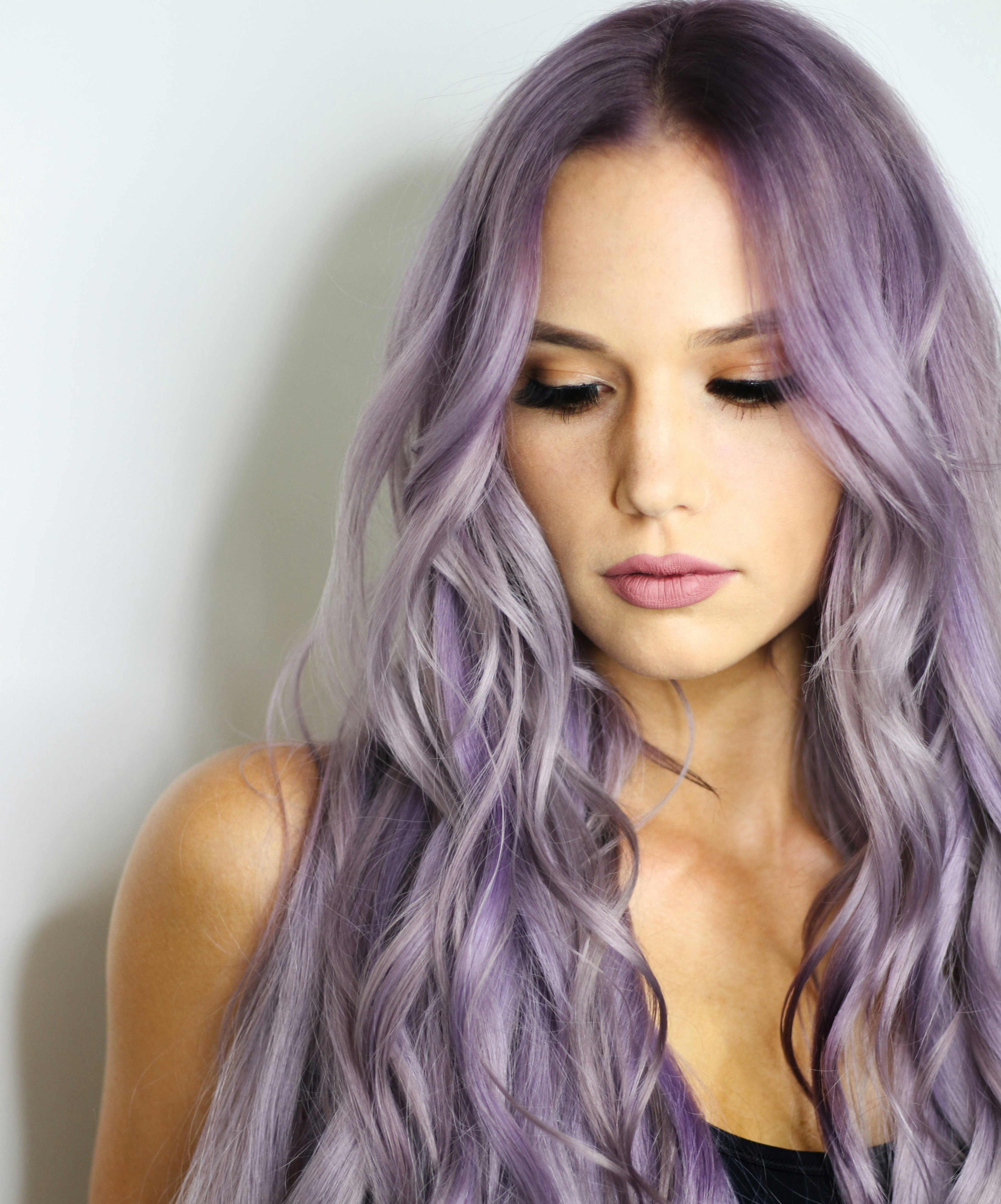 A woman with long purple hair