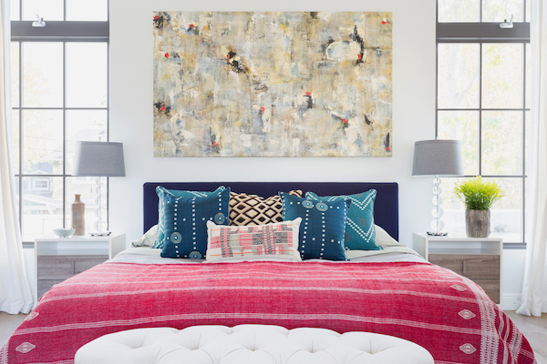 Skyfall painting hanging above a bed