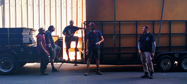 Our crew enjoing some downtime in front of our truck and trailer