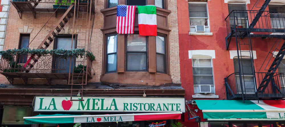 Buildings in Little Italy with hanging Italian and American flags