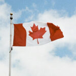 Canadian flag against a sky background