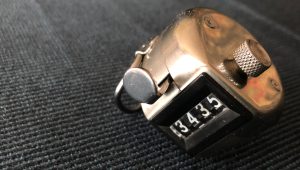 A close-up on a small, metal counter, displaying 3435.