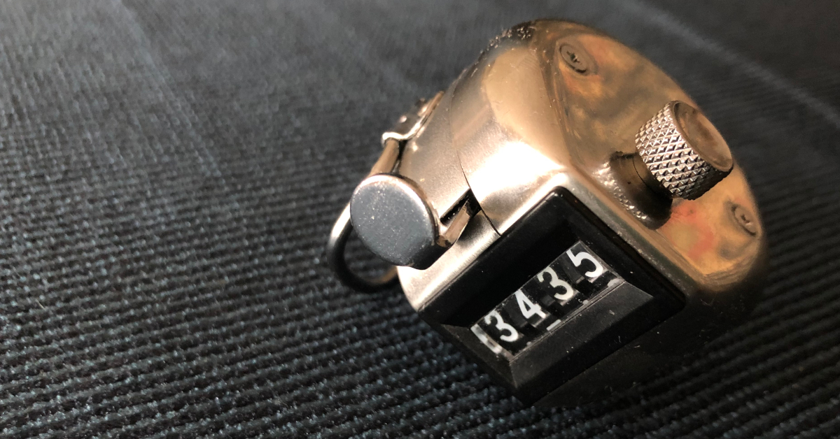 A close-up on a small, metal counter, displaying 3435.