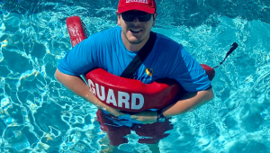 Santa Ana lifeguard floating in pool