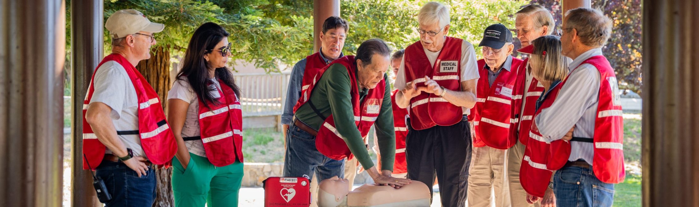 residents wearing red block captain vests