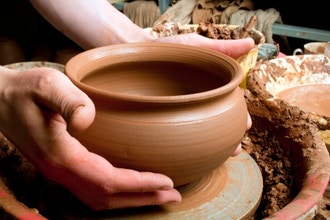 Two Hands making Ceramic Pottery