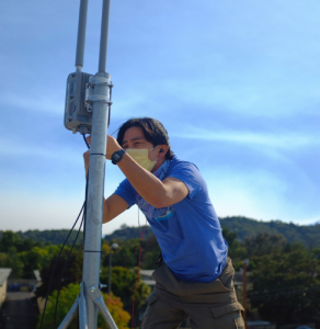 man installing a wifi access point